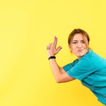 front-view-female-doctor-posing-yellow-space.jpg