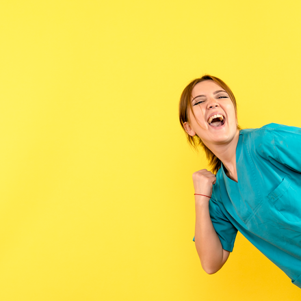 front-view-female-doctor-rejoicing-yellow-space.jpg